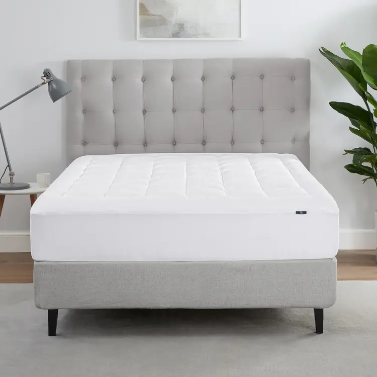 The Serta ComfortSure Mattress Pad on a bed