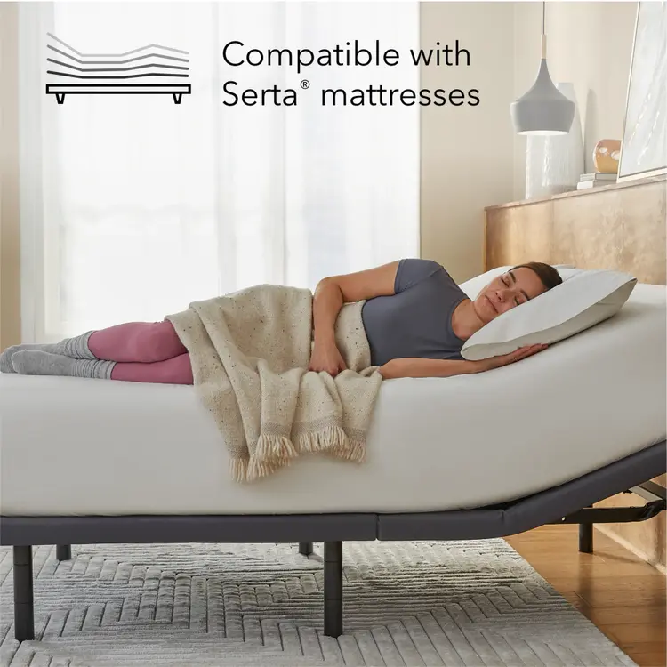 Woman laying asleep on a white mattress sitting on a Baselogic Gold Adjustable Base