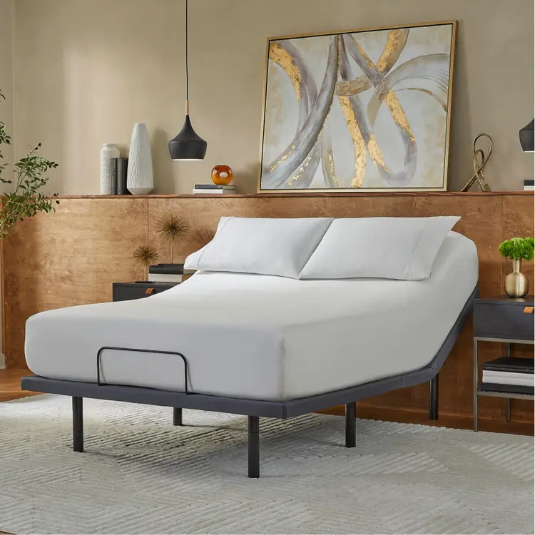 Baselogic Gold Adjustable Base with a white mattress sitting on top of it.